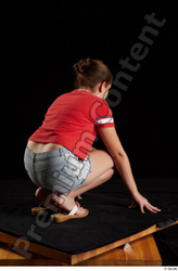 Whole Body Woman White Shirt Jeans Shorts Average Kneeling Studio photo references